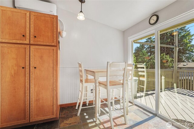 2120 Seaview St W, University Place, WA 98466 - dining room featuring a wall mounted air conditioner and lofted ceiling