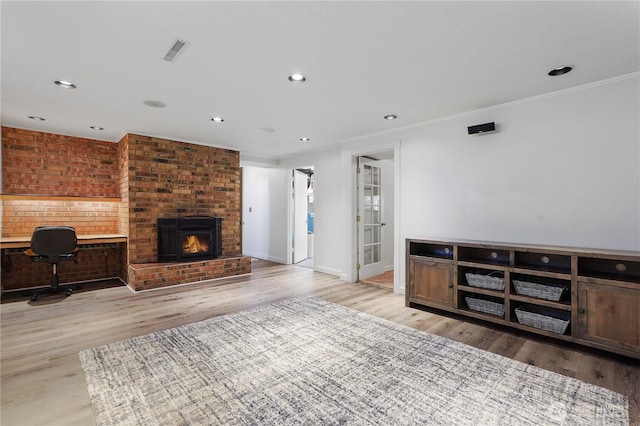 2120 Seaview St W, University Place, WA 98466 - unfurnished living room featuring light wood finished floors, recessed lighting, ornamental molding, a fireplace, and a desk