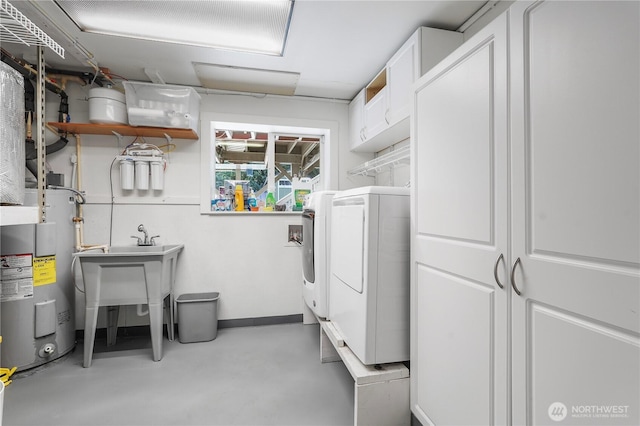 2120 Seaview St W, University Place, WA 98466 - laundry area with electric water heater, washer and dryer, and cabinet space