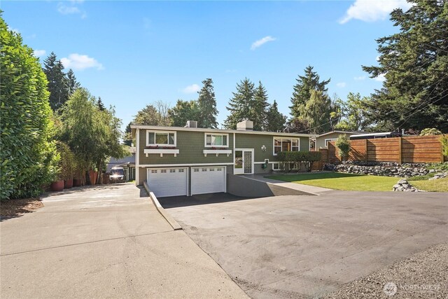2120 Seaview St W, University Place, WA 98466 - split foyer home with an attached garage and driveway