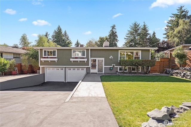 2120 Seaview St W, University Place, WA 98466 - bi-level home with concrete driveway, a garage, and a chimney
