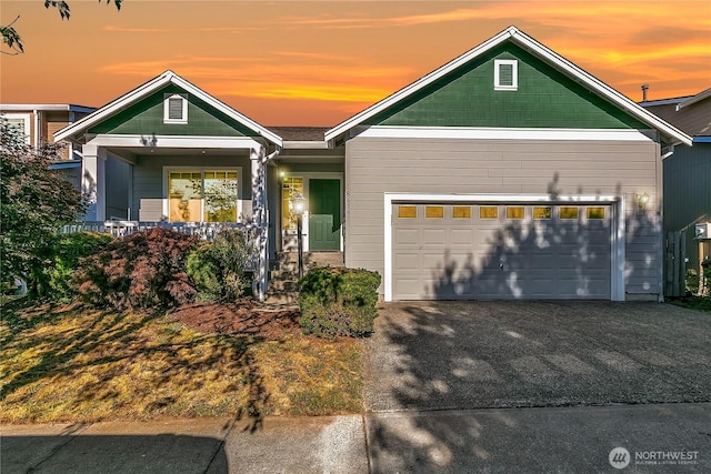 18619 16th Avenue Ct E, Spanaway, WA 98387 - view of front of house featuring an attached garage, driveway, and a porch
