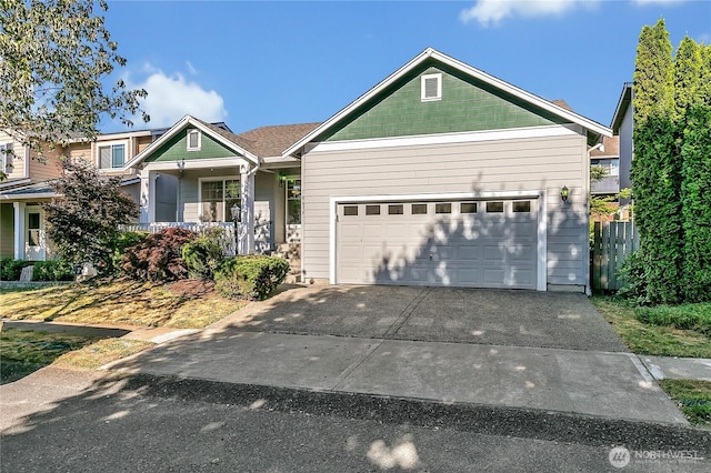 18619 16th Avenue Ct E, Spanaway, WA 98387 - view of front of home featuring driveway, an attached garage, and a porch