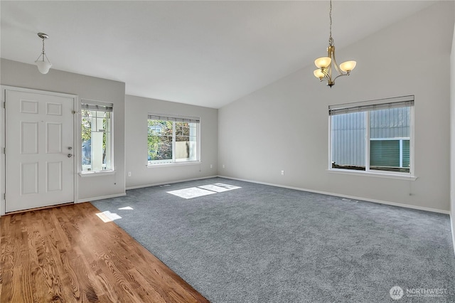 18619 16th Avenue Ct E, Spanaway, WA 98387 - entrance foyer featuring lofted ceiling, a chandelier, and carpet floors