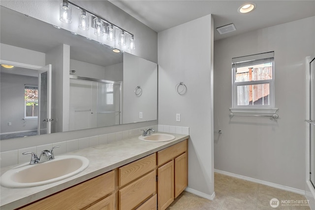 18619 16th Avenue Ct E, Spanaway, WA 98387 - bathroom featuring double vanity, a shower stall, tile patterned floors, and recessed lighting