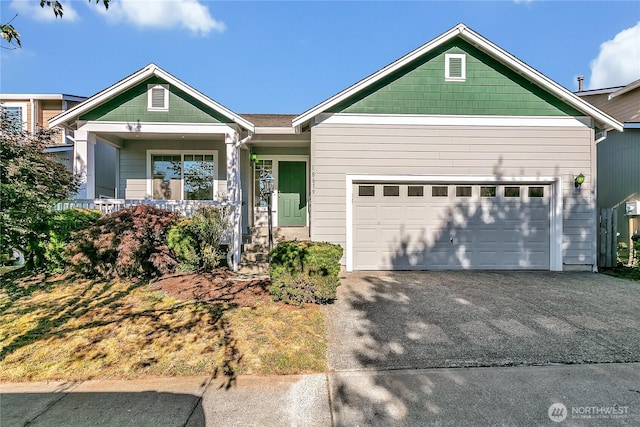 18619 16th Avenue Ct E, Spanaway, WA 98387 - ranch-style house featuring asphalt driveway, a garage, and a porch