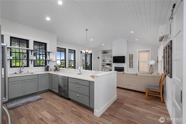 46 Seaside Ln, Pacific Beach, WA 98571 - kitchen with stainless steel dishwasher, gray cabinets, vaulted ceiling, wooden ceiling, and a peninsula