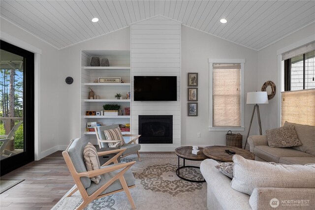 46 Seaside Ln, Pacific Beach, WA 98571 - living area featuring lofted ceiling, wood finished floors, recessed lighting, wood ceiling, and a fireplace