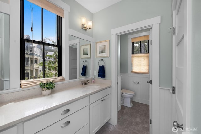 46 Seaside Ln, Pacific Beach, WA 98571 - bathroom with plenty of natural light, vanity, and wainscoting
