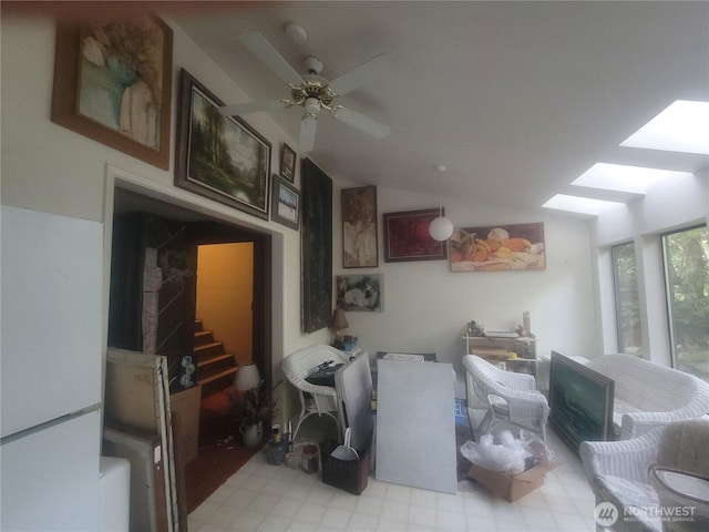 35806 1st Ave S, Federal Way, WA 98003 - living room featuring a skylight, lofted ceiling, light floors, a ceiling fan, and stairway