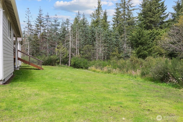 250 W Wynwood Dr, Shelton, WA 98584 - view of grassy yard with a view of trees and stairway