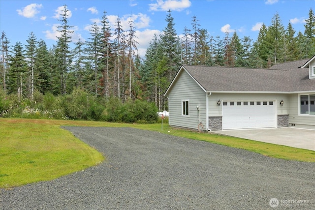 250 W Wynwood Dr, Shelton, WA 98584 - view of home's exterior featuring an attached garage, driveway, a shingled roof, and a lawn