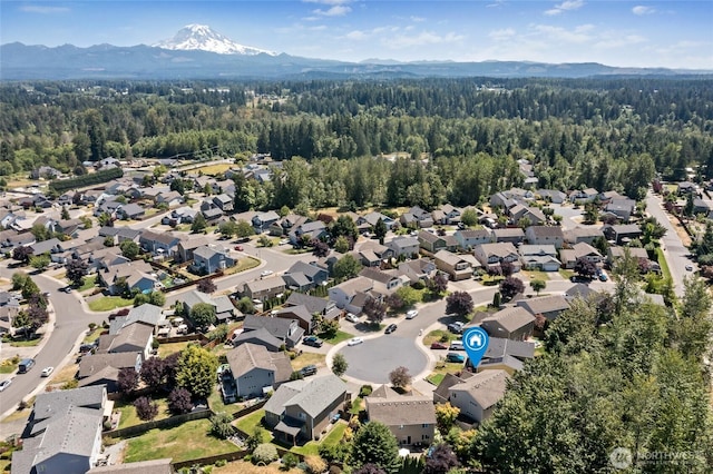 21012 82nd St E, Bonney Lake, WA 98391 - aerial view of residential area with a forest and mountains