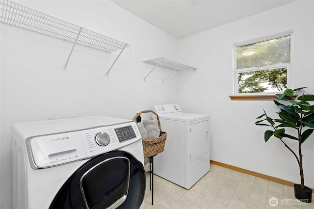 21012 82nd St E, Bonney Lake, WA 98391 - laundry room featuring washing machine and clothes dryer and baseboards