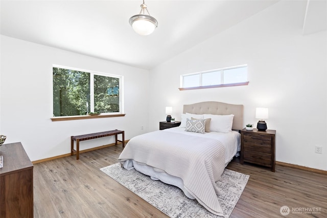 21012 82nd St E, Bonney Lake, WA 98391 - bedroom with multiple windows, wood finished floors, and lofted ceiling