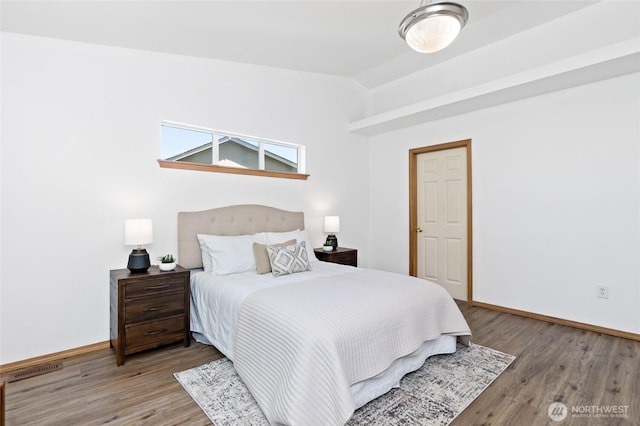 21012 82nd St E, Bonney Lake, WA 98391 - bedroom with lofted ceiling and wood finished floors