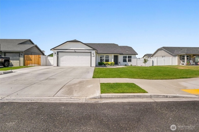 1344 E Deborah St, Moses Lake, WA 98837 - view of front facade featuring a garage, concrete driveway, and a gate