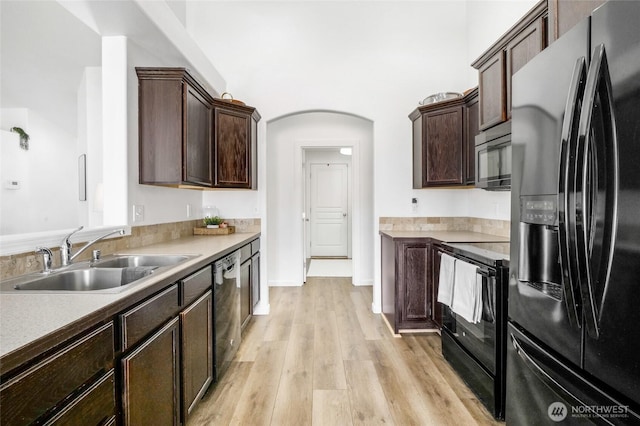 1344 E Deborah St, Moses Lake, WA 98837 - kitchen with fridge with ice dispenser, black electric range, dark brown cabinets, stainless steel dishwasher, and light wood-type flooring