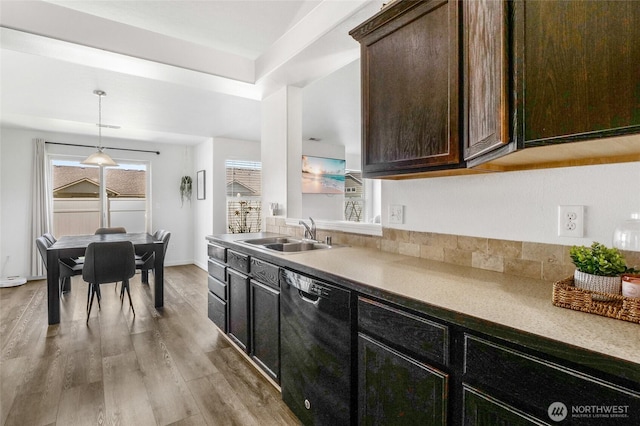 1344 E Deborah St, Moses Lake, WA 98837 - kitchen with black dishwasher, light wood-style floors, healthy amount of natural light, and dark brown cabinetry