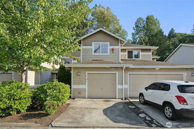15150 140th Way SE Unit K103, Renton, WA 98058 - view of front of home with driveway and a shingled roof