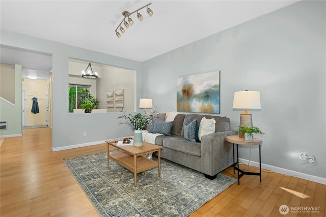 15150 140th Way SE Unit K103, Renton, WA 98058 - living area featuring wood-type flooring and a chandelier