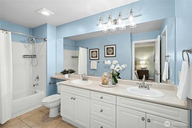 15150 140th Way SE Unit K103, Renton, WA 98058 - ensuite bathroom with double vanity, shower / bath combo with shower curtain, and tile patterned floors
