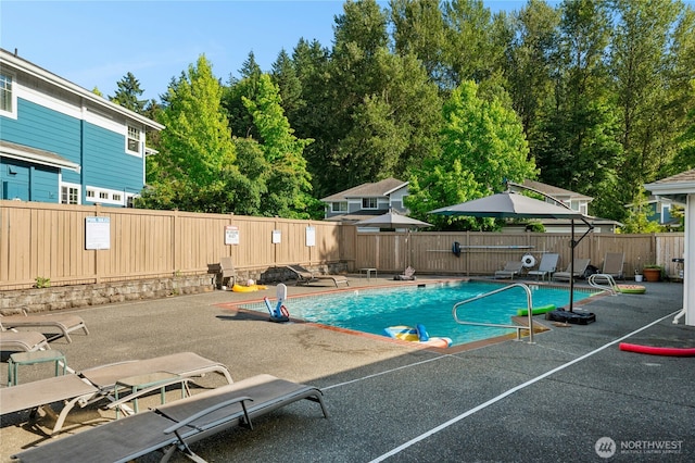 15150 140th Way SE Unit K103, Renton, WA 98058 - view of pool featuring a patio and a fenced backyard
