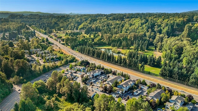 15150 140th Way SE Unit K103, Renton, WA 98058 - aerial overview of property's location with a heavily wooded area and nearby suburban area