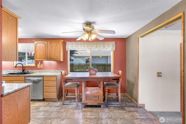 5215 Richmond Cres, Blaine, WA 98230 - kitchen featuring dishwasher, ceiling fan, a textured ceiling, light stone countertops, and stone finish floors