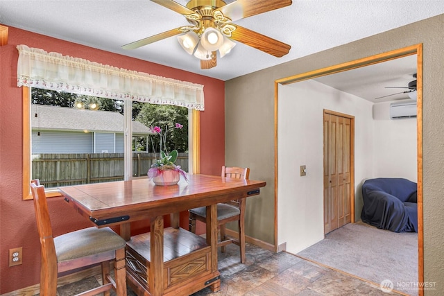 5215 Richmond Cres, Blaine, WA 98230 - dining area featuring ceiling fan, a wall mounted AC, and stone finish flooring