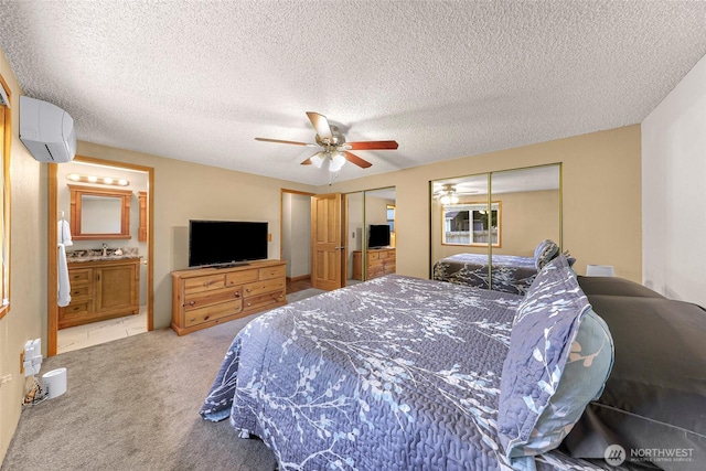 5215 Richmond Cres, Blaine, WA 98230 - bedroom featuring a wall mounted air conditioner, carpet, ceiling fan, a textured ceiling, and ensuite bath