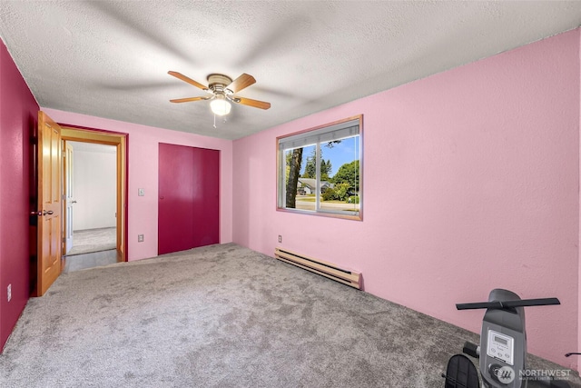 5215 Richmond Cres, Blaine, WA 98230 - unfurnished bedroom featuring baseboard heating, a textured ceiling, carpet, ceiling fan, and a closet