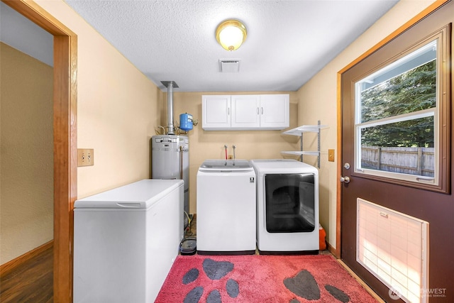 5215 Richmond Cres, Blaine, WA 98230 - laundry room with washer and clothes dryer, cabinet space, a textured ceiling, and electric water heater