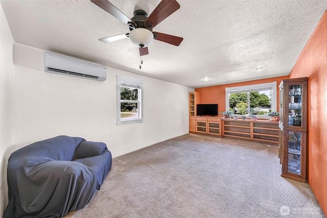 5215 Richmond Cres, Blaine, WA 98230 - sitting room featuring a wall mounted air conditioner, a textured ceiling, carpet, and ceiling fan