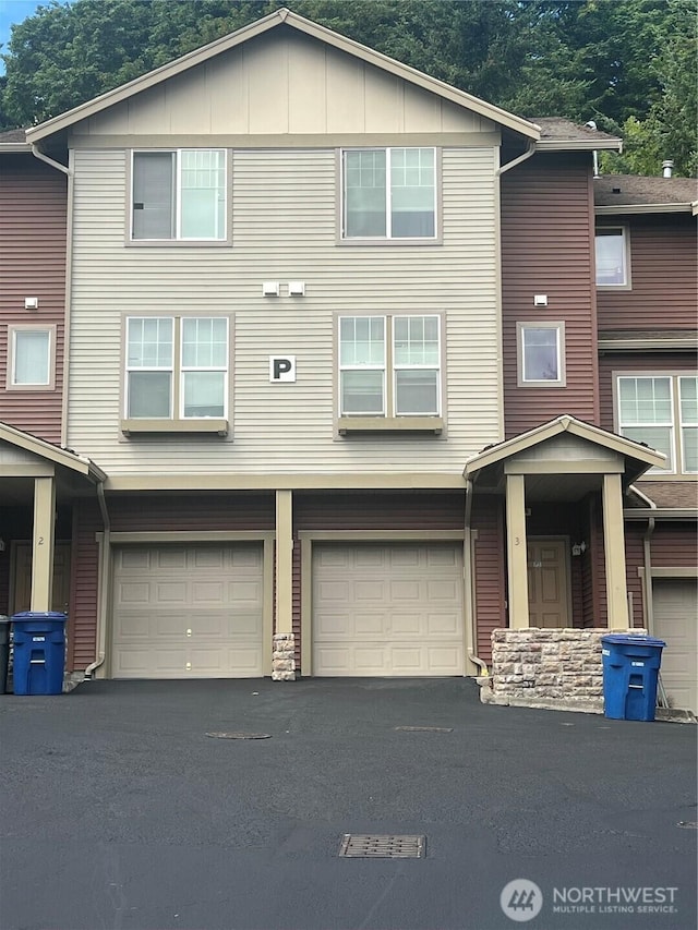 21507 42nd Ave S Unit P3, Seatac, WA 98198 - view of property featuring a garage and driveway