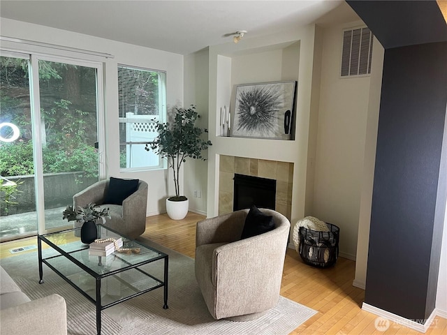 21507 42nd Ave S Unit P3, Seatac, WA 98198 - living area featuring wood finished floors and a tile fireplace