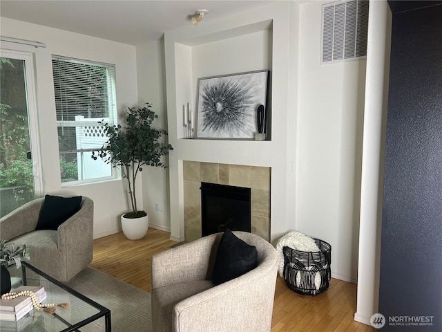 21507 42nd Ave S Unit P3, Seatac, WA 98198 - living area featuring wood finished floors and a fireplace