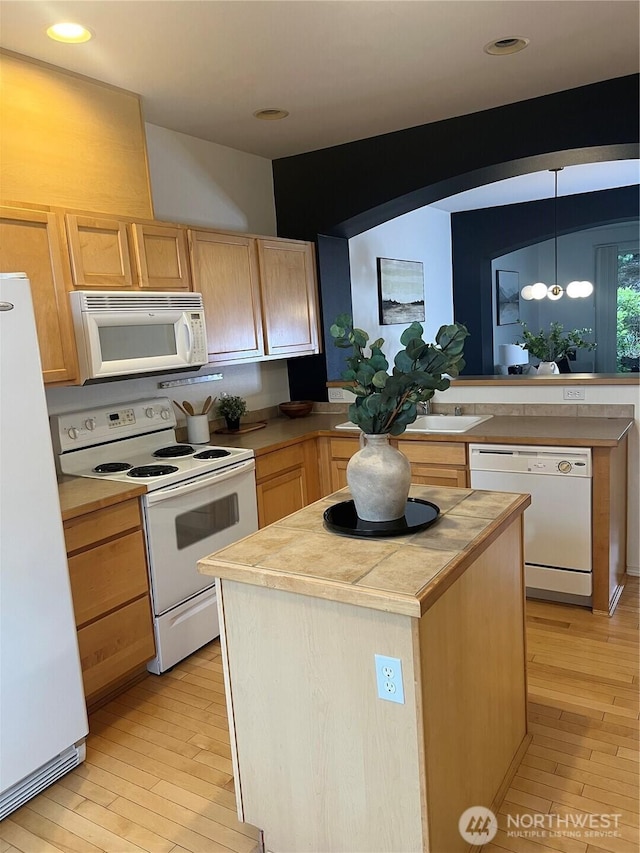 21507 42nd Ave S Unit P3, Seatac, WA 98198 - kitchen featuring white appliances, light wood-style floors, light brown cabinets, a center island, and recessed lighting