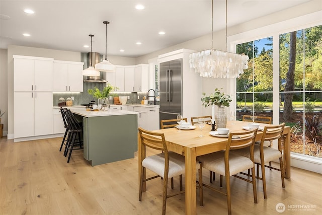 10511 NE 112th St, Kirkland, WA 98033 - dining room with recessed lighting, light wood-style flooring, and a chandelier