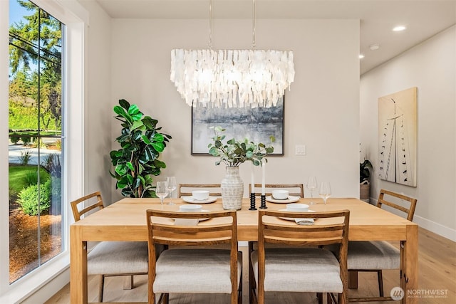 10511 NE 112th St, Kirkland, WA 98033 - dining space with light wood finished floors, a chandelier, and recessed lighting