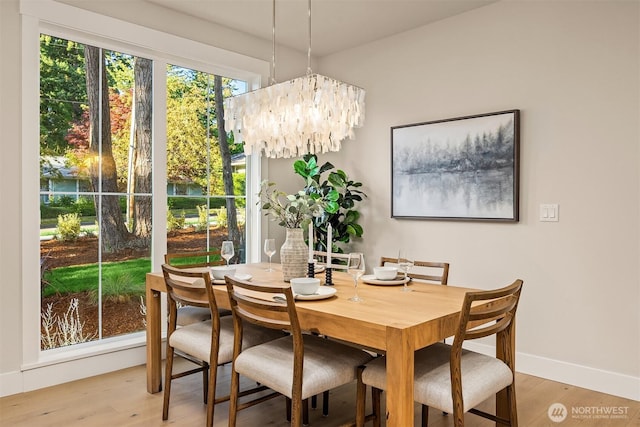 10511 NE 112th St, Kirkland, WA 98033 - dining space with light wood finished floors and a chandelier