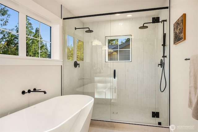 10511 NE 112th St, Kirkland, WA 98033 - full bath featuring healthy amount of natural light, a freestanding tub, and a stall shower
