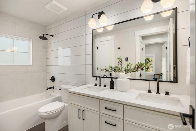 10511 NE 112th St, Kirkland, WA 98033 - bathroom with tile walls, double vanity, and tub / shower combination