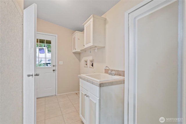 261 E Emerald Lake Dr W, Grapeview, WA 98546 - washroom with washer hookup, light tile patterned floors, and cabinet space