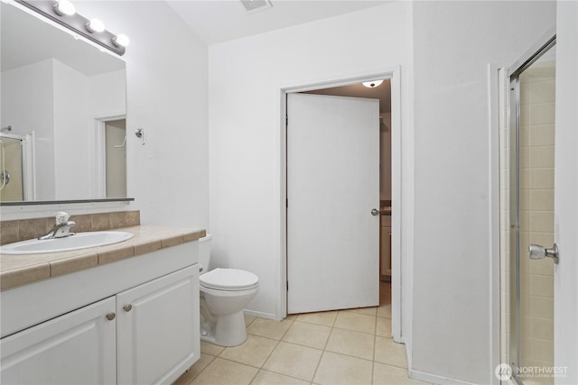 261 E Emerald Lake Dr W, Grapeview, WA 98546 - bathroom featuring vanity, tile patterned flooring, and a shower with door