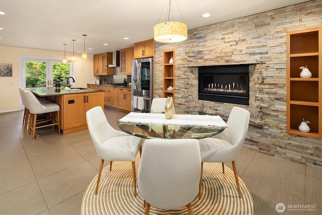17905 3rd Ave NW, Shoreline, WA 98177 - dining room featuring light tile patterned floors, recessed lighting, a fireplace, and built in features