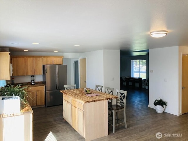 2020 Perch Ave, Moses Lake, WA 98837 - kitchen featuring freestanding refrigerator, dark wood finished floors, a kitchen island, wood counters, and a breakfast bar