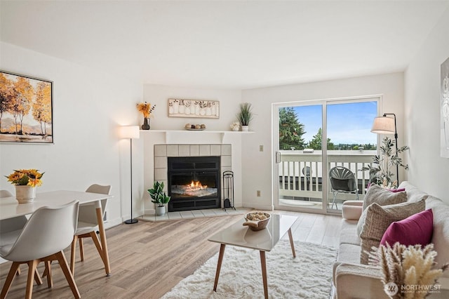 411 N 90th St Unit 406, Seattle, WA 98103 - living area featuring wood finished floors and a fireplace
