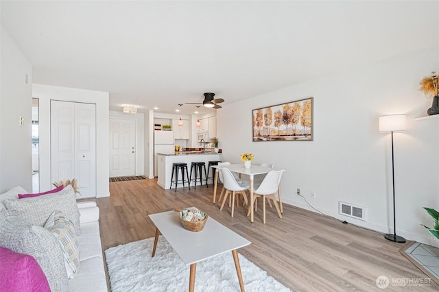 411 N 90th St Unit 406, Seattle, WA 98103 - living room with light wood finished floors, ceiling fan, and recessed lighting