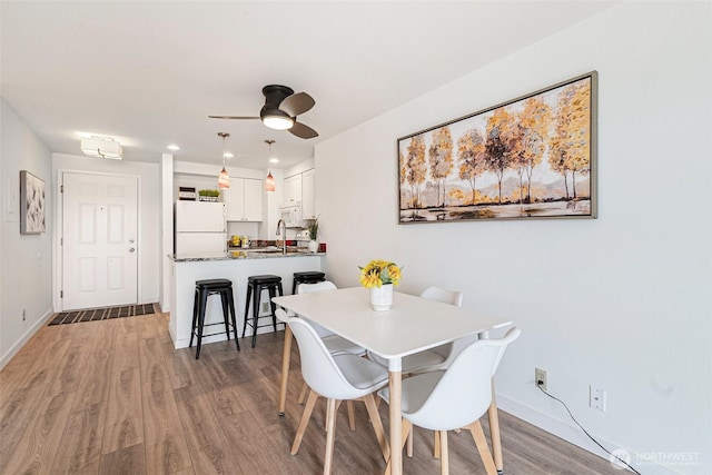 411 N 90th St Unit 406, Seattle, WA 98103 - dining room featuring light wood finished floors, ceiling fan, and recessed lighting